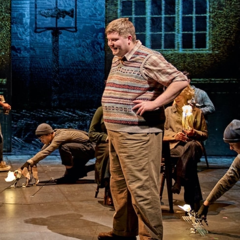 man on stage in play