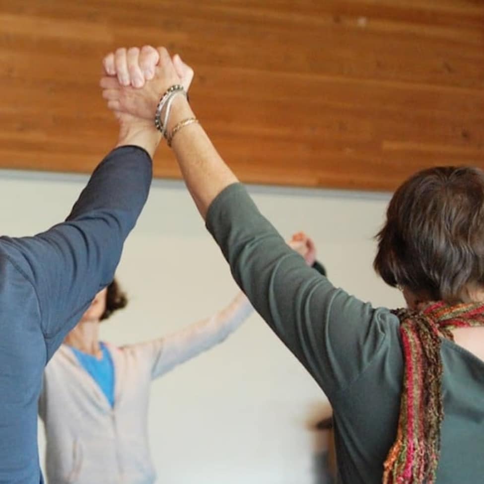 circle of people holding hands